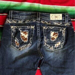 Women’s miss me jeans with cow print detailing on the pockets